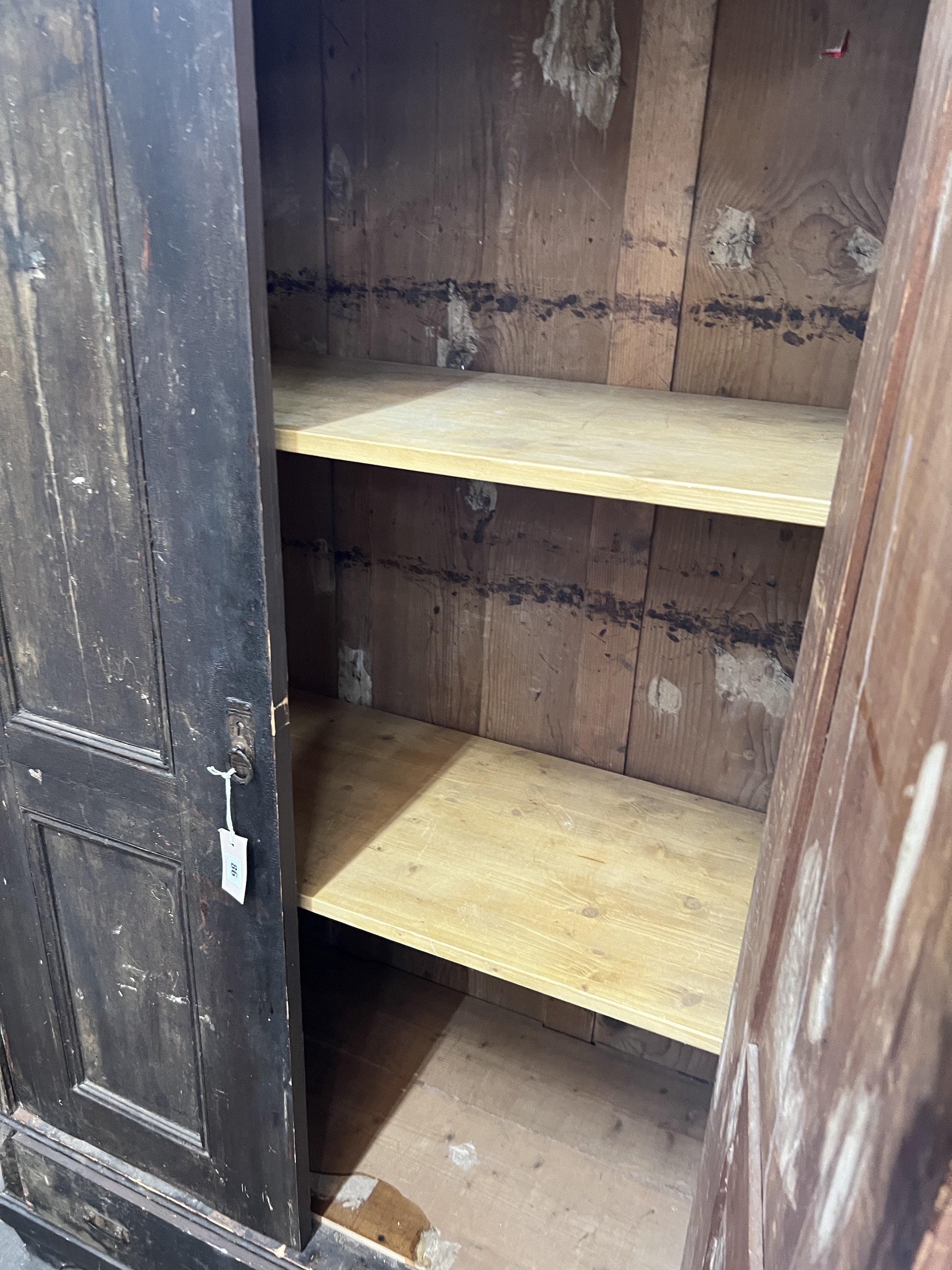 A 19th century East European stained pine household cupboard, width 105cm, depth 50cm, height 182cm